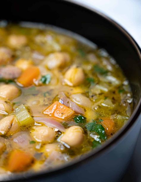 Close up photo of a bowl of vegan chickpea soup Greek Chickpea Soup, Vegan Greek Recipes, Greek Lemon Soup, Healthy College Meals, Lentil Potato Soup, Soup With Lemon, Greek Chickpeas, Lemon Soup, Vegan Lentil Soup