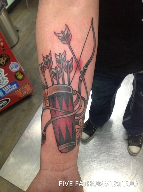 While most bow and arrow tattoo ideas feature a single arrow being drawn back in a bow this guy puts a different spin on the idea by including an entire quiver of arrows, inked in a beautiful bright red and with flowing leather straps.  #tattoos #tattoofriday #tattooart #tattoodesign #bowandarrowtattoomeaning |arrow#bowandarrowtattooideas #bowandarrowtattoo  #crossbowtattoo #bowandarrowwristtattoo #bowandarrowtattoosforguy Quiver Tattoo, Arrow Tattoo With Name, Tattoo Bow And Arrow, Crossbow Tattoo, Bow And Arrow Tattoos, Native American Sleeve, Small Arrow Tattoo, Arrow Tattoos For Men, Arrow Tattoo Meaning