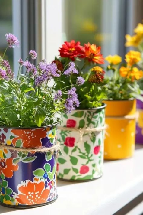 Transform your recycling into chic home decor with these eco-friendly upcycled tin can planters. This project is perfect for those looking to add a personal touch to their garden or indoor space while keeping sustainability in mind. Aimed at garden lovers and DIY enthusiasts, these with can planters are ideal for small succulents and vibrant flowers alike. Grab your old cans, some paint, and get creative. Learn techniques to style them that blend effortlessly with your decor while enjoying the environmentally-friendly advantage. Recycled Tin Can Crafts, Can Painting Diy Tin, Metal Can Crafts, Tin Can Garden Ideas, Diy Tin Can Projects, Creative Planter Ideas, Tin Can Planters, Can Planters, Painted Tin Cans