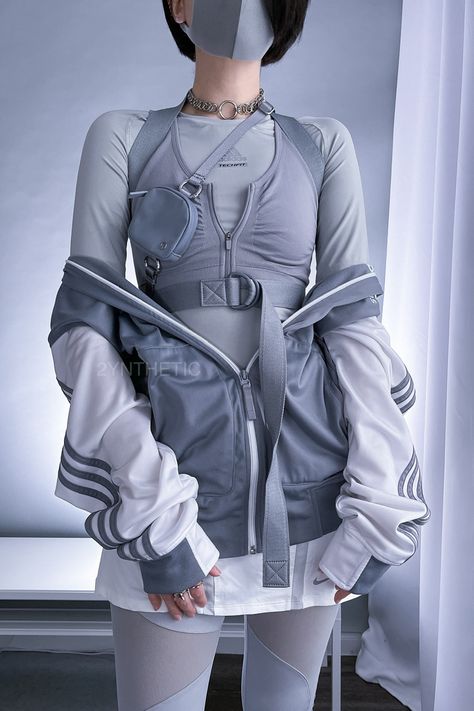 A person with short black hair is standing and wearing an all grey techwear outfit, with a white and grey Adidas track jacket. Cool Techwear Outfits, Feminine Cyberpunk Outfit, Cyberpunk Outfit Inspiration, Future Aesthetic Outfit, Blue Techwear Outfit, Outfit Ideas Futuristic, Rococo Techwear, Futuristic Casual Fashion, Korean Futuristic Fashion