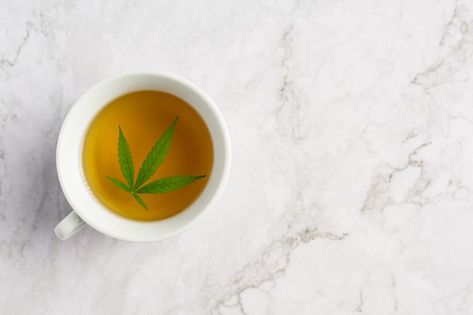 Cup of hemp tea with hemp leaves put on ... | Free Photo #Freepik #freephoto #medical #green #leaf #tea Photo Cup, Bob Marley Art, Hemp Leaf, White Marble Floor, Marble Floor, White Marble, Lab, Free Photos, Tea