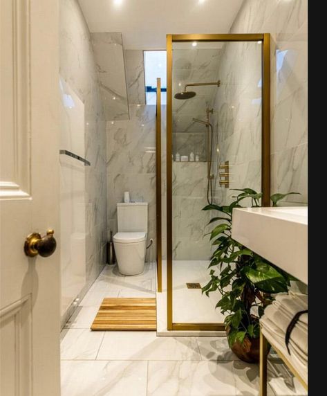 A renovated modern white gold theme bathroom with open shower Gold Theme Bathroom, Theme Bathroom, Open Showers, Themed Bathroom, Bronze Bathroom, Gold Theme, House Inspo, Oversized Mirror, White Gold