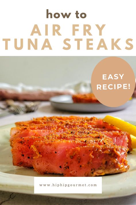 sliced seasoned tuna steak on a plate with a lemon, another in the background Ways To Cook Tuna Steak, Air Fried Tuna Steak, How To Prepare Tuna Steaks, How To Cook Tuna Steak In Air Fryer, Tuna Steak Air Fryer Recipes, Airfryer Tuna Steak, Ahi Tuna Air Fryer, Air Fry Tuna Steak, Tuna In Air Fryer