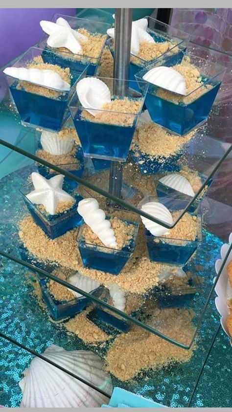 Sea shells jello Mermaid Jello Ideas, 7 Seas Birthday Party, Shark And Mermaid Theme Birthday Party, Ariel Food Ideas Under The Sea, Quinceanera Mermaid Theme, Luca Party Food, Mermaid Beach Party Ideas, Ariel Themed Food, Luca Dessert Table