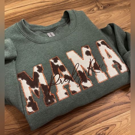 New In Bag “Mama” Cowprint Sweatshirt. Photos Of The Sweatshirt With Name Are Stock Photos From The Store So You Can See What It Looks Like. The Only Thing On This Sweatshirt Is “Mama” Fall Mom Sweatshirt, Mom Embroidered Sweatshirt, Applique Sweatshirts, Embroidery Designs Sweatshirt, Trending Sweatshirts, Trending Embroidery, Hand Embroidered Sweatshirt, Sew Shirt, Handmade Tops