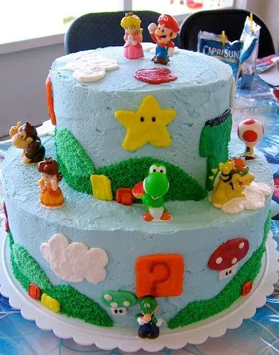 Super Mario Birthday Cake - HubPages Super Smash Bros Cake Ideas, Mario And Luigi Birthday Cake, Super Mario Cake Ideas, One Tier Mario Cake, Mario Birthday Cake No Fondant, Round Mario Cake, Super Mario 2 Tier Cake, Mario 1 Up Mushroom Cake, Mushroom Cake