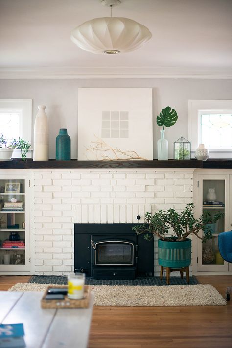 Sofa Blocking Fireplace, Long Mantel Decor, White Fireplace With Shelves On Side, Long Mantle Ideas, Faux Brick Fireplace Surround, Partially Painted Brick Fireplace, Long Fireplace Mantle, White Brick Fireplace With Black Mantle, Living Room Built Ins With Windows