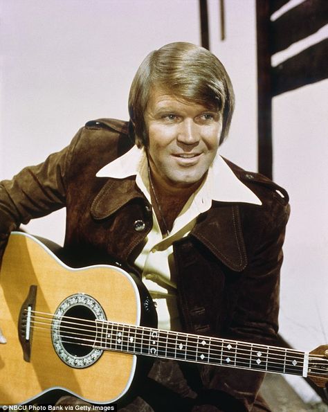 Campbell was one of the biggest stars of the late 1960s and 1970s. He sold more than 45 million records, had 12 gold albums and 75 chart hits Glen Campbell Rhinestone Cowboy, Elvis Performing, Glenn Campbell, Vintage Dolly Parton, 1990s Music, Country Guitar, Ovation Guitar, Marty Robbins, Rhinestone Cowboy