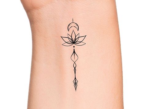 Arrow Lotus Crescent Moon Temporary Tattoo Size: The size of this temporary tattoo is approximately 2 inches Directions: 1. Cut excess paper around tattoo with scissors to eliminate any unnecessary adhesive on your skin after applying. 2. Peel away the clear plastic layer. 3. Apply the tattoo image side to your skin and cover with a damp cloth for 20 seconds. 4. Carefully peel back paper off of your skin and allow the tattoo to dry for at least 10 seconds. Do not touch it. 5. After allowing for Lotus Crescent Moon Tattoo, Lotus And Arrow Tattoo, Lotus Arrow Tattoo, 1 Inch Tattoos, Wrist Tattoos Girls, Purple Tattoos, Shamrock Tattoos, Arrow Tattoo Design, Petit Tattoo