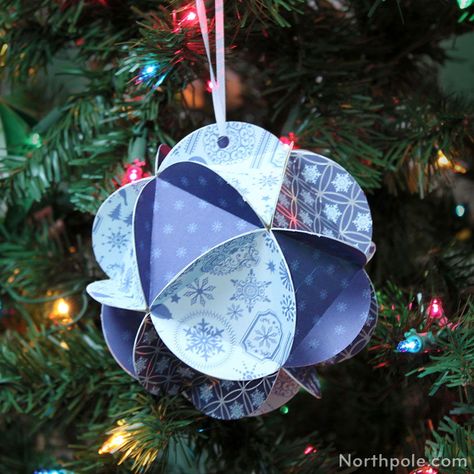 Make this super-cute icosahedron out of cardstock, old Christmas cards, gift bags, or even gift boxes. Full DIY on northpole.com/craftcottage #christmascraft #christmasornament #ornament #christmas #handmade Cardstock Ornaments, Dyi Christmas Ornaments, Picture Christmas Ornaments, Craft Cottage, Paper Christmas Decorations, Paper Christmas Ornaments, Diy Christmas Tree Ornaments, Festive Crafts, Paper Ornaments