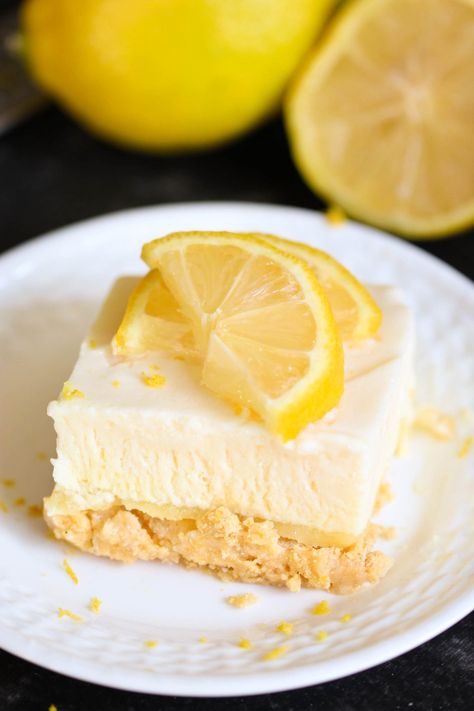 Frozen Lemon Fluff Dessert - Six Sisters' Stuff | This lemony dessert is so creamy, refreshing and perfect for Easter or a spring time dessert! Made with a lemon oreo crust, these are a real party treat! #dessert #easter #easterdessert #sixsistersrecipes Lemon Fluff Dessert, Lemon Fluff, Lemon Oreos, Spring Time Desserts, Lemon Jello, Lemon Health Benefits, Frozen Lemon, Fluff Desserts, Six Sisters Stuff