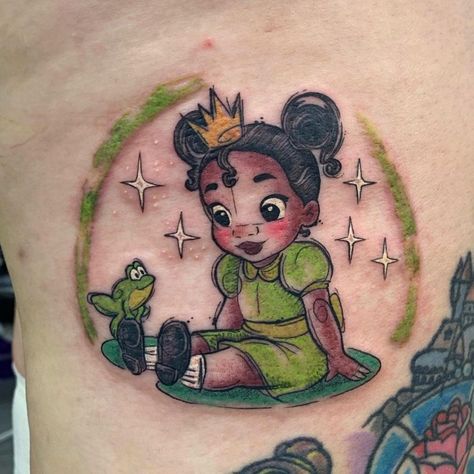 Up Disney Tattoo Ideas, Princess And The Frog Inspired Tattoo, Small Character Tattoos, Tiana Princess And The Frog Tattoo, Tiana Tattoo Disney, Disney Tattoos Princess, Disney Glitter Tattoo, Cartoon Tattoos Women, Cartoon Characters Tattoo Ideas