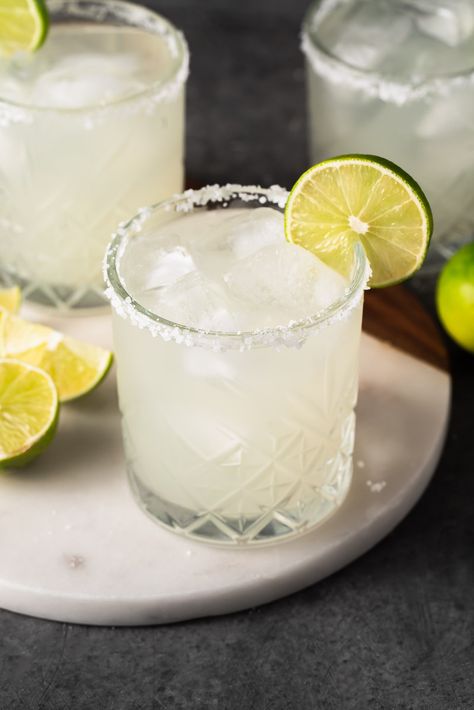 You only need a few simple ingredients to make these classic margaritas. They're perfect for warm summer nights out, or even for date night. This recipe is one you'll be coming back to again and again. #classic #margaritas #vegan #recipe #sweetsimplevegan #cocktail #bar #margarita #fresh #lime #citrus Chickpeas Benefits, Easy Margarita Recipe, Classic Margarita Recipe, Vegan Breakfast Options, Easy Margarita, Cookie Recipes Oatmeal Raisin, Perfect Margarita, Dim Light, Slice Of Lime