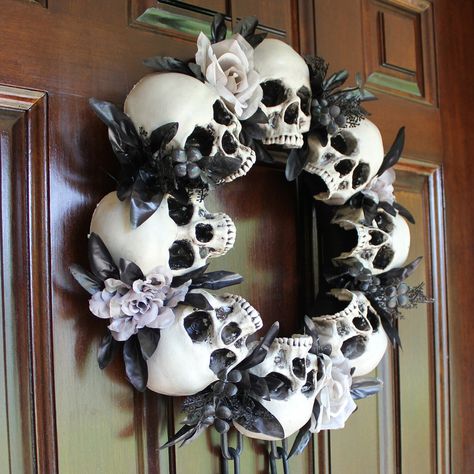 Add a tastefully creepy touch to your home this Halloween with the Haunted Decor Collection from Haunted Hill Farm. Our bone-chilling wreath is just what you need to turn your home into the scariest house on the block. Gruesome dungeon skulls with floral accents and dangling chains decorate the entire wreath. This spooky holiday wreath will create a hair-raising display to impress all your ghoulish guests. Haunted Hill Farm 0.27-ft 15.7-in Wreath | HHSKEL-9WRTH Skulls Halloween Decorations, Skull Ideas Decor, 5 Below Halloween Decor, Skeleton Head Decor, Jason Wreath Halloween, Halloween Door Garland Diy, Spooky Christmas Decor, Skull Decorating Ideas, Haunted Decor