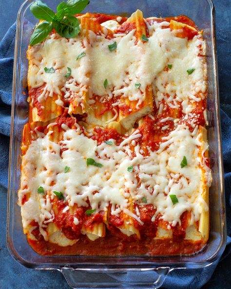 Manicotti is an easy Italian dinner. Pasta stuffed with a three cheese filling. The whole family loves this. #manicotti #recipe #italian #dinner Stuffed Manicotti With Italian Sausage, Easy Stuffed Manicotti Recipe, Cheese Manicotti Recipe Easy, String Cheese Stuffed Manicotti, Manicotti Recipe Sausage, Stuffed Manicotti With Meat, Cheese Filled Pasta, Mexican Manicotti, Stuffed Manicotti Recipe