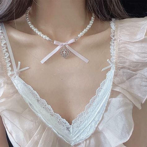 Dainty little necklace, check out our accessories and jewelry at Ballerinacore.com 🫶 🩰 🫶 🩰 #necklace #balletcore #photography #sweet #cross #heart #fashion #accessories #newcollection #style #styleinspiration #fashionstyle #explorepage #coquette #coquettefashion #coquetteaesthetic #coquettecore #coquettegirl #jewelry #dollette #dolletteaesthetic #doll #pretty #prettygirl #dainty #daintyjewelry #softgirl #softgirlaesthetic #instagood #photooftheday Silver Piercings, Coquette Diy, Necklace Y2k, Beads Style, Romantic Necklace, Y2k Jewelry, Korean Jewelry, Simple Pearl, Jewelry Nails