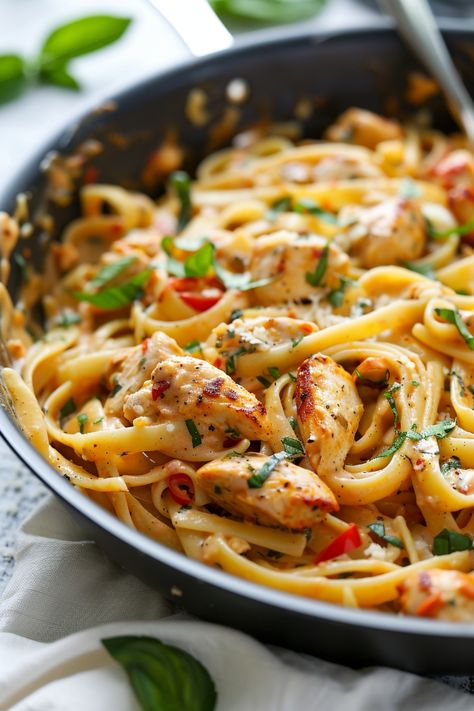 Indulge in a flavorful dinner tonight with this delicious Cajun Chicken Pasta recipe. Perfectly seasoned chicken, tender veggies, and al dente pasta come together in a creamy Cajun sauce for a meal that's sure to satisfy your taste buds. This easy-to-make dish is ideal for busy weeknights or weekends when you want something comforting yet exciting. Treat yourself and your loved ones to the bold flavors of this Cajun Chicken Pasta – you won't be disappointed! Cajun Chicken Linguine Alfredo, Cajun Chicken Pasta Bake, Best Cajun Pasta, Tgi Fridays Cajun Chicken Pasta Recipe, Creamy Curry Pasta, Cajun Spaghetti Recipes, Chicken Cajun Pasta Recipes, Cream Of Chicken Pasta Recipes, Cajun Chicken Linguine