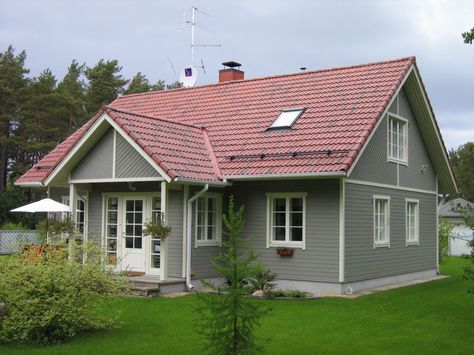 Grey wood house, exterior, squared windows, red roof Red Roof Gray House, Red Shingle Roof Exterior Colors, Red Roof Grey House, House Colors With Red Roof, Grey House With Red Roof, Red Shingles House Colors, House Exterior Red Roof, Red Metal Roof Houses Color Combos, Red Roof House Colors Home Exteriors