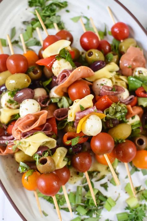 These delicious heavier appetizer recipes are perfect for a cocktail party or game night. They're great for a gathering when you want to serve substantial Hors d'oeuvres and not a full meal! Mozerella And Tomato Skewers, Summer Snacks For Party Finger Foods, Charcuterie Kabobs, Italian Appetizers Party, Mozzarella Skewers, Italian Finger Foods, Meatball Skewers, Italian Appetizers Easy, Heavy Appetizers