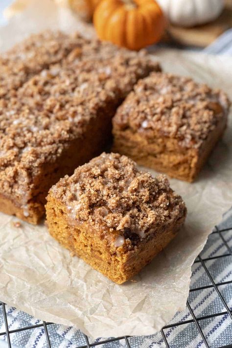 Vegan Pumpkin Coffee Cake is the perfect fall treat! It's soft and moist and loaded with spiced pumpkin goodness. The crisp streusel topping and drizzle of sweet icing make it absolutely irresistible! Enjoy a slice with a cup of coffee for breakfast, snacks, or dessert. Make it gluten-free with one swap! Vegan Pumpkin Coffee Cake, Pumpkin Streusel Coffee Cake, Gluten Free Pumpkin Cake, Pumpkin Coffee Cake, Pumpkin Streusel, Streusel Coffee Cake, Pumpkin Coffee Cakes, Pumpkin Coffee, Spiced Pumpkin