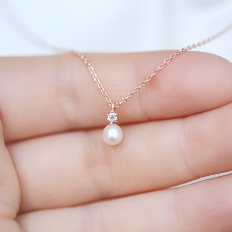 Tiny Diamond & Pearl necklace✨ fresh water pearl and natural diamond setting pendant necklace. 14K solid gold jewelry. * Detail * Material : 14k solid gold with fresh water pearl and genuine diamond. color : rose gold, gold or white gold * Size * Necklace length : 16.5 inches (If you want change chain length, please leave order note.) Pendant : 5*10 mm Diamond: Genuine 2mm brilliant cut diamond / VS Clarity / H color. Pearl : 4.5~5mm fresh water pearl.  *We provide special package with some Simple Pearl Pendant, Diamond Necklace Simple, Fresh Water Pearl Necklace, Simple Pearl Necklace, Water Pearl Necklace, Pearl Necklace Designs, Pearl And Diamond Necklace, Necklace Diamond, Gold Pearl Necklace