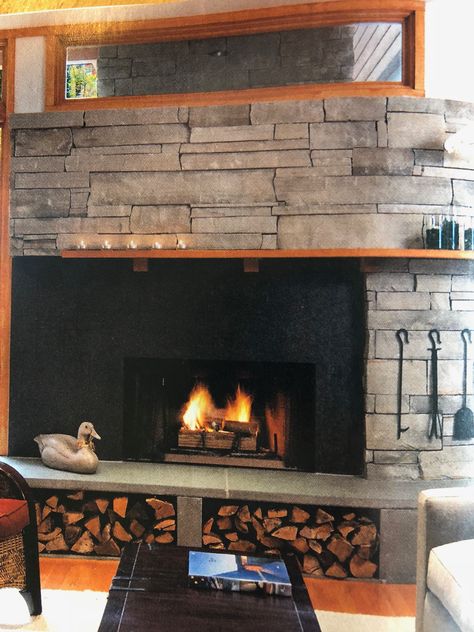 Wood storage under hearth Wood Storage Under Fireplace Hearth, Wood Storage Under Fireplace, Hearth Wood Storage, Fireplace With Wood Storage Underneath, Built In Wood Storage By Fireplace, Fireplace Wood Storage Built Ins, Nook Fireplace, Adobe Fireplace, Wrought Iron Porch Railings