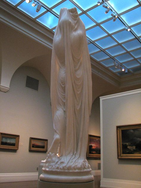 Undine - Chauncey Ives. Carved from marble, 1884. "Undine was the heroine of a popular French 19th century romantic novel in which a mermaid princess forsakes the carefree life of a water-spirit to gain a soul by marrying the mortal knight she loves. When her husband proves unfaithful, Undine is forced by the laws of the water-spirits to kill him. Ives depicts the moment when the mournful Undine, cloaked in a white veil, rises from the castle's wellspring to claim her husband's life" -yale.edu Undine Rising From The Waters, Undine Rising, Water Spirit, Shadow Art, Marble Statues, Greek Art, Sculpture Installation, Life Drawing, Art And Architecture