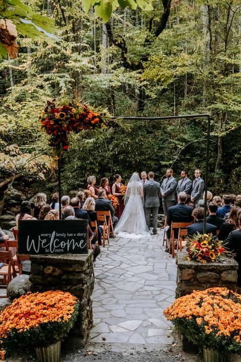 Bright oranges, yellows, reds and purples in the flowers | Huge orange mums | Wood welcome sign | Echelon Florist | Smoky Mountain Wedding | National Park Wedding | Fall Wedding | Spence Cabin Ceremony | Appalachian Clubhouse Reception | Derek Halkett Photography | Absolute Wedding Perfection Mums Fall Wedding, Mums Flowers Wedding Decor, Mums At Wedding Ceremony, Fall Foliage Wedding Decor, Fall Wedding Venue Decor, Tennessee Orange Wedding, Fall Wedding Pergola, Fall Wedding Elopement Ideas, Fall Cottage Wedding