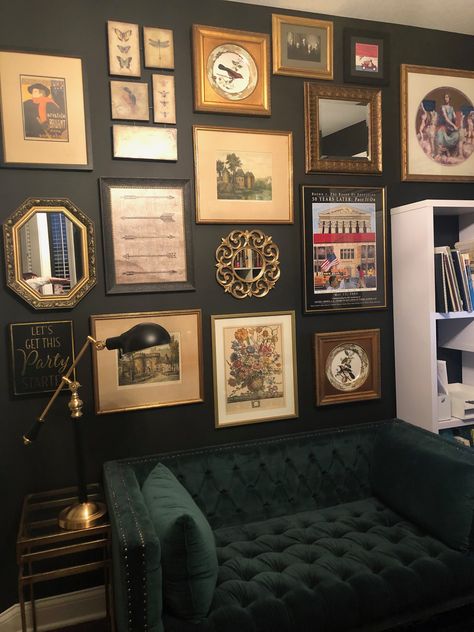 Gallery wall, green sofa, black wall, gold frames Black Accent Gallery Wall, Black Wall Lounge Room, Black Wall Green Couch, Picture Wall Ideas Dark Wall, Maximal Wall Art, Dark Green Wall Gallery, Green Wall With Pictures, Gold Frames On Black Wall, Basement Gallery Wall