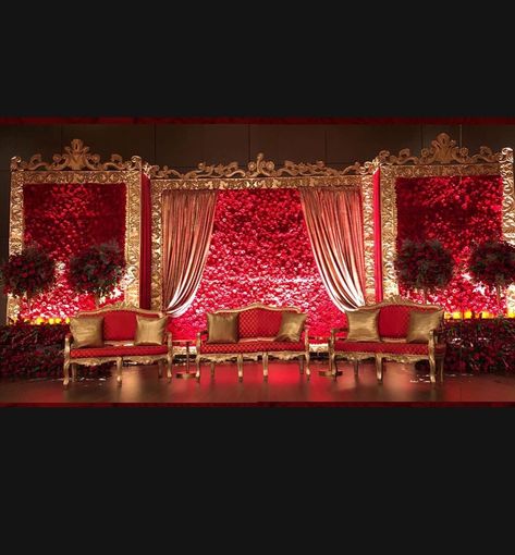 Royal Reception Stage Decoration, Red Theme Wedding Stage Decor, Red Wedding Stage Decor, Red Wedding Decorations Indian, Red Stage Decoration, Barat Stage Decoration Pakistan, Red Wedding Stage, Reception Stage Decoration Indian Indoor, Bride Stage