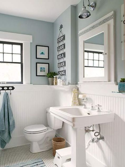 a cozy vintage farmhouse bathroom with light blue walls, white beadboard, a free standing sink, some art and much light Light Blue And White Bathroom, Bathroom Wall Cladding, Blue Bathrooms, Blue And White Bathroom, Bathroom Equipment, Light Blue Bathroom, White Wood Paneling, Architecture Unique, Blue Bathroom Decor