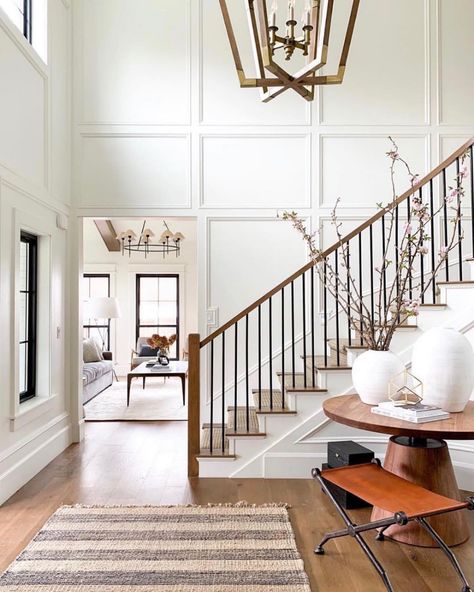 Crown Molding On High Ceilings, Modern Cozy Staircase, Paneling On Staircase, Open Staircase Accent Wall, Stair Ballister Ideas, Two Story Wainscoting, Wall Paneling Staircase, Foyer Molding Two Story, Stairwell Paneling