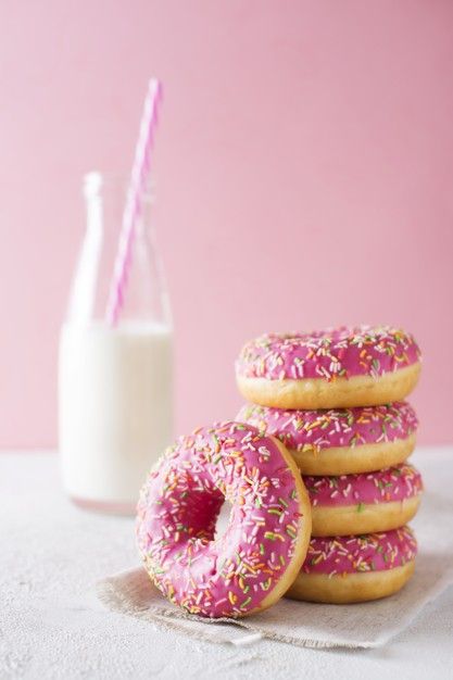 Stack of pink and white donuts with bottle of milk over pink Premium Photo Doughnuts Photography, Baking Wallpaper, Donut Photos, Donut Decorating Ideas, Pastel Desserts, Bottle Of Milk, Donut Art, Decadent Food, Sugar Donut