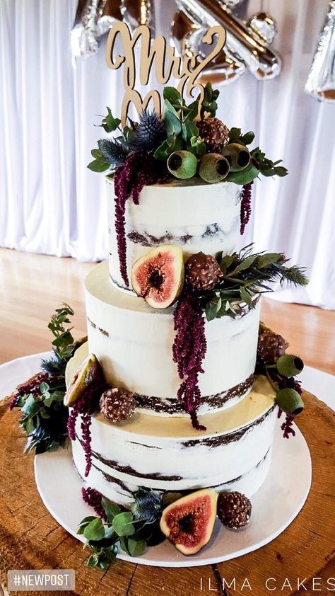 One of my favourite semi naked wedding cakes so far dressed with fresh figs, ferrero rocher chocolates & stunning native florals. Finished with a custom made topper supplied by the bride and groom. Filled with Tim tam chocolate mud cake and white chocolate raspberry mud cake Florals by Functions 2 Flowers #ilmacakes #weddingscakes #weddingseason ilmacakes.com Ferrero Rocher Wedding Cake, Chocolate Raspberry Wedding Cake, Wedding Cake Figs, Fig Wedding, Wedding Cake Diy Decorating, Cake Florals, Wedding Cake Topper Acrylic, Silhouette Wedding Cake, Wedding Cake Topper Silhouette