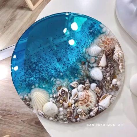 The Best Epoxy Resin Projects on Instagram: “How beautiful! Comment your thought. Credit @anitakorzun_art . Follow @epoxyprojects for more . . . . . #resinbeach #resinart #resinepoxy…” Shells In Resin Ideas, Epoxy Shell Art, Epoxy Resin Crafts Coasters, Resin Art With Seashells, Seashell Resin Art, Resin Seashell Crafts, Resin Ocean Art Diy, Sea Resin Art, Epoxy Resin Crafts Ocean