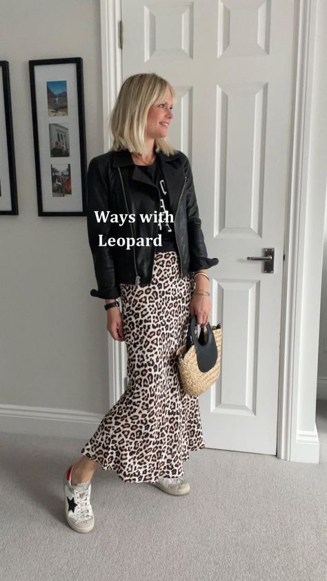 Wearing leopard print 🐆 🐆🐆 I have lost count of the number of outfits here but there are sooooo many different ways (and I could have carried on) to wear a leopard print skirt… 🐆 With plain and slogan tees 🐆 Add denim/leather jackets 🐆 Trainers/sandals/boots/heels of various styles depending on the look you want to create. 🐆 A shirt is also lovely. 🐆 And sweatshirts/ fine or chunky knits. 🐆 Plus dress it up for the evening with a cami and blazer. I definitely think this surpasses my Rul Leopard Print Skirt Outfit Autumn, How To Wear A Black Skirt, Leopard Silk Skirt Outfit, Leopard Satin Skirt Outfit, Leopard Skirt Outfit 2024, Midi Skirt Outfit Work, Printed Midi Skirt Outfit, Skirt Outfits Dressy, Leopard Midi Skirt Outfit