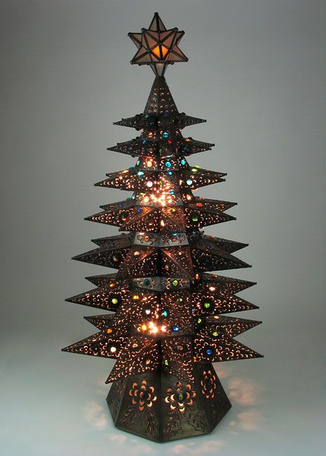 Mexican Christmas Tree. http://www.directfrommexico.com/mexican-star-tin-christmas-tree-or3011.html Mexican Christmas Tree, Tin Punch, Mexican Christmas Decorations, Star Christmas Tree, Rustic Christmas Decor, Tin Star, Punched Tin, Mexican Christmas, Metal Christmas Tree