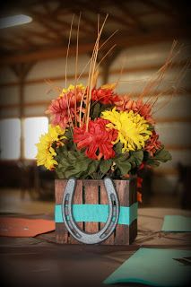 I added ribbon and a mini cast iron horseshoe to little wooden flower arrangements I found at Walmart. Tied in nicely with our little western wedding! Western Centerpieces, Mini Cast Iron, Quince Decorations, Quinceanera Decorations, Western Theme Party, Horseshoe Crafts, Western Parties, Cowboy Theme, Western Theme