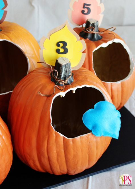 Pumpkin Bean Bag Toss Game - To play, the children will be able to take turns tossing the bean bags into the pumpkins, and the number value on each pumpkin will represent how many points that pumpkin is worth. #RoomMother #HalloweenParty #classroomparty Fall Festival Games, Festival Planning, Patch Party, Pumpkin Games, Fest Ideas, Fall Harvest Party, Fall Carnival, Pto Ideas, Festival Games