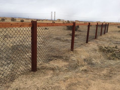 4' California Chain link fence using 4x4 cedar posts and 2x4 cedar top rail stained with Cabot Mahogany stain and 4' black chain link fabric. Black Chain Link Fence With Wood, Black Chain Link Fence Ideas, Fence Post Installation, Black Chain Link Fence, Wood Fence Ideas, Cedar Fence Posts, Cyclone Fence, Chain Fence, Cedar Wood Fence