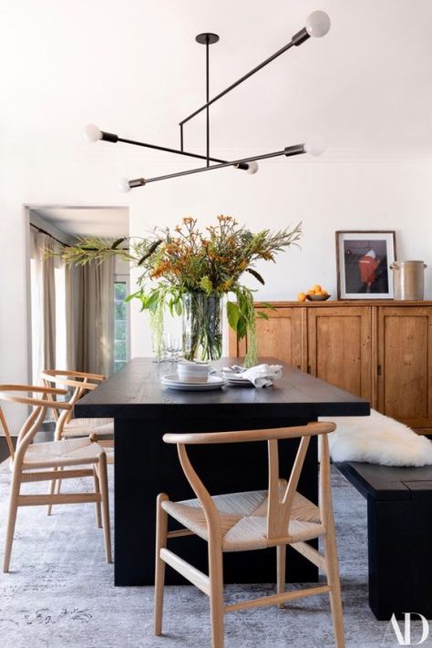 Modern light fixture above dark wood dining table. Mid Century Dining Room, Black Dining, Ashley Tisdale, Mid Century Dining, Dining Table Black, The Dining Room, Hollywood Hills, Dining Room Inspiration, Black Table