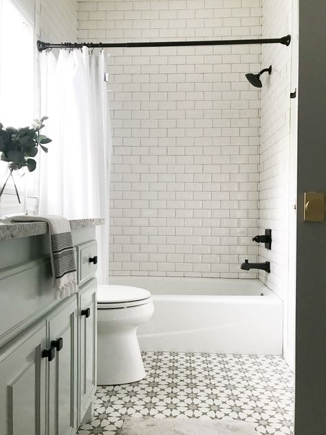 Updating 90s House, Patterned Tile Bathroom, Updated Traditional Home, Updated Traditional Decor, Shiplap Feature Wall, Guest Bath Ideas, Bathroom Decor Ideas On A Budget, 90s House, Tile Tub Surround