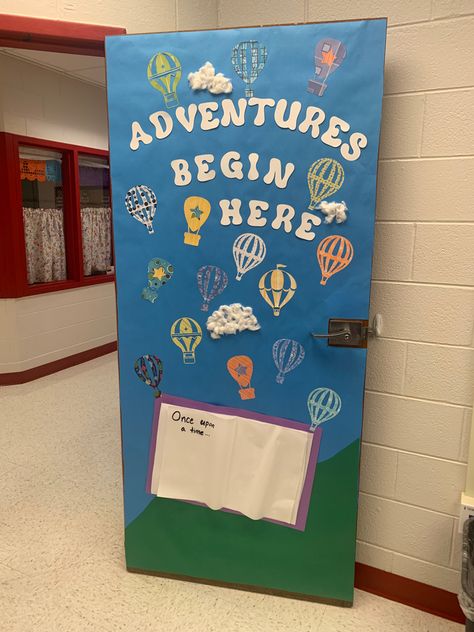 Classroom door decorated with blue background, a book that says, “once upon a time”, hot air balloons lifting up into the sky. The door says, “Adventures begin her”. School Decorations Ideas Classroom Setup, Classroom Door Decoration Ideas, Class Door Decorations, Decorate Classroom, Preschool Door, Classroom Door Decor, Door Decoration Ideas, Class Door, School Door Decorations