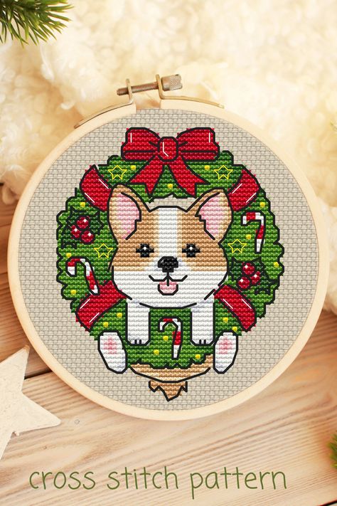 Christmas Corgi cross stitch pattern PDF by Ilike Cross Stitch. Baby dog cross stitch. Cute cross stitch. Small cross stitch pattern for baby room and clothes decorating. Animal cross stitch pattern. This cross-stitch pattern can be used to decorate clothes, towels, pillows, kitchen textiles, as well as wall decor. Corgi Cross, Cross Stitch Necklace, Corgi Christmas, Holiday Cross Stitch, Cross Stitch Christmas Ornaments, Small Cross Stitch, Animal Cross Stitch Patterns, Cute Cross Stitch, Cross Stitch Patterns Christmas