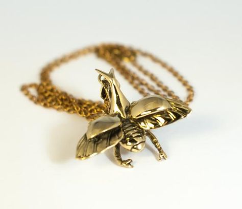 this gorgeous pendant is made from a casting of a real Rhinoceros Beetle. ▲▲▲•••••••••••••••••••••••••••••• FEATURES •••••••••••••••••••••••••••••••▲▲▲ - Handmade using un-lacquered brass - Comes with a choice of chain: 16, 18 or 32 - Part of our Hibernation collection: Intricately cast pieces Rhinoceros Beetle, Amber Resin, Stag Beetle, Animal Bones, Tiny Earrings, Pendant With Chain, Brass Jewelry, Beetles, In Nature