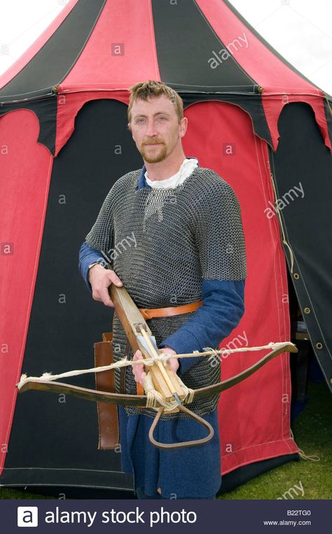 Download this stock image: Reenactor outside tent, holding traditional Cross-bow at Scottish Historical Saltire Society event, Fort George, Ardersier, Grampian, Scotland uk - B22TG0 from Alamy's library of millions of high resolution stock photos, illustrations and vectors. Crossbow Poses Drawing Reference, Cross Bow Drawing, Crossbow Reference Pose, Holding Crossbow Reference, Crossbow Pose, Cross Bow, Holding Staff Pose, Bow Drawing, Bow Pose