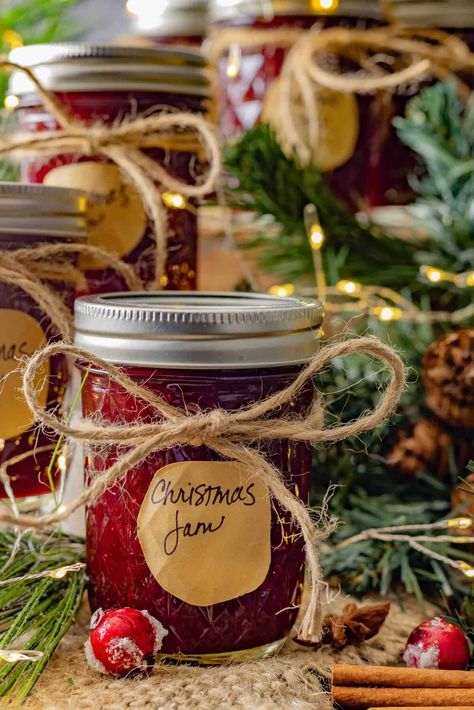 This Sweet Christmas Jam is a festive blend of tangy cranberries, sweet strawberries, and warm holiday spices that capture the essence of the season. Perfect as a thoughtful homemade gift or a delicious addition to your holiday appetizers, this jam is bursting with flavor and holiday cheer. Christmas Jam Canning Recipe, Christmas Spice Jam, Christmas Jam Recipes Homemade, Winter Jam Recipes, Christmas Jam Recipes, Holiday Jam, Canning Jam Recipes, Jam Gift, Christmas Jam