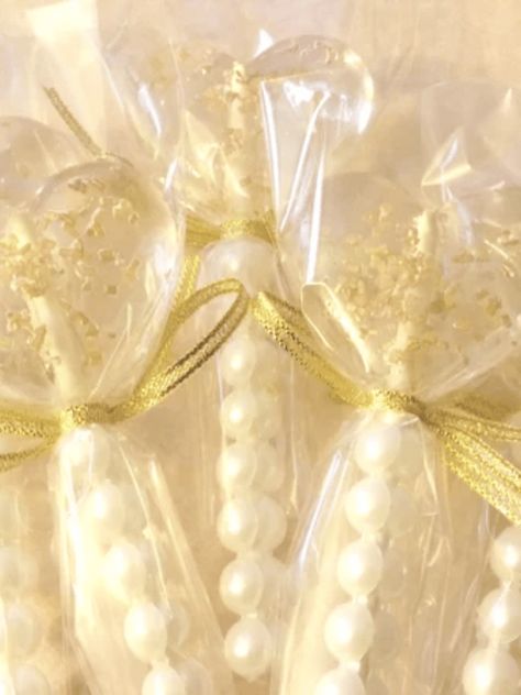 Timeless but also trendy, pearls are hot right now for weddings. Browse some of our favorite pearl wedding details to incorporate into your big day. Pearl Wedding Favors, Pearl Themed Bridal Shower, Pearl Theme Bridal Shower Ideas, Pearl Wedding Ideas, Pearl Bridal Shower Theme, Pearls And Prosecco Theme, Pearl Themed Wedding, Pearl Wedding Decor, Pearls Centerpiece