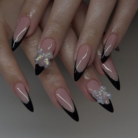 Black French Nails With Flowers, Nails For Black Dress Classy, Black Flower Nail Designs, Almond Acrylic Nails Black, Black Nails Acrylic Almond, Black French Tip With Charms, Black Nails With Bow, Black French Tips With Design, Black Almond French Tip