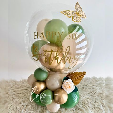 ✨ Our stunning bubble balloon arrangement is perfect for tabletop display! Featuring eucalyptus, cream, and gold hues, adorned with pearl accents, golden butterfly and a beautiful white rose. 🎈💕 . . . #Lovoballoonbouquets #lovoballoonsandgifts #lovoballoon #balloonbouquet #balloonart #premiumballoondisplay #brisbaneballoons #brisbaneballoonartist #balloonartistaustralia #smallbusinessaustralia #ballooninspo #boboballoon #bubbleballoonarrangement #decobubble #30thbirthdayballoondecor Bubble Balloons Bouquet, Bubble Balloon Bouquet, Mother’s Day Small Balloon Bouquet, Balloon Bar, Happy Mother’s Day Bobo Balloons, Balloon Arrangement, Deco Ballon, Golden Butterfly, 85th Birthday